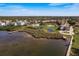 Waterfront property with community pool, boardwalk, pond and well manicured lawn with neighborhood views at 351 Windrush Loop, Tarpon Springs, FL 34689