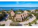 Beautiful aerial view of waterfront condos with community pool and well manicured grounds on a sunny day at 351 Windrush Loop, Tarpon Springs, FL 34689