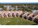 Aerial view highlighting condo balconies, pristine lawns, and well-maintained landscaping at 351 Windrush Loop, Tarpon Springs, FL 34689