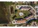 Spectacular overhead view of condo community with community pool, pond, and waterfront location at 351 Windrush Loop, Tarpon Springs, FL 34689