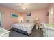Light-filled bedroom with coastal decor, ceiling fan, and charming white furniture at 351 Windrush Loop, Tarpon Springs, FL 34689