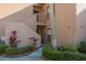 Entrance to a condo with stairs leading to the main level, siding, and a view of the front yard at 351 Windrush Loop, Tarpon Springs, FL 34689