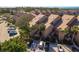 Exterior daytime shot of condo building showing architecture, parking, and landscaping at 351 Windrush Loop, Tarpon Springs, FL 34689