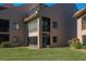 Exterior view of condo showing the well manicured lawns at 351 Windrush Loop, Tarpon Springs, FL 34689