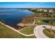Boardwalk alongside a waterfront property with access to walking trails and views of the ocean at 351 Windrush Loop, Tarpon Springs, FL 34689