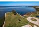 Beautiful waterfront property with manicured lawn, boardwalk and access to the water and recreation at 351 Windrush Loop, Tarpon Springs, FL 34689
