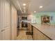 The beautifully updated kitchen features stainless appliances and granite countertops at 351 Windrush Loop, Tarpon Springs, FL 34689