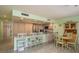 Eat-in kitchen features stainless appliances, granite counters, and a dining area at 351 Windrush Loop, Tarpon Springs, FL 34689