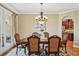 Cozy dining room with hardwood floors, neutral walls, and access to the kitchen at 3637 Ballastone Dr, Land O Lakes, FL 34638