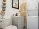 Cozy bathroom featuring a sink vanity and stacked washer and dryer at 3715 98Th N Ave # 3, Pinellas Park, FL 33782