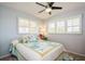 Bright bedroom with nautical bedding, ceiling fan, and plantation shutters at 3715 98Th N Ave # 3, Pinellas Park, FL 33782