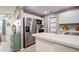 Well-equipped kitchen with updated stainless steel appliances, adjacent to living area for entertaining at 3715 98Th N Ave # 3, Pinellas Park, FL 33782