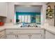 Bright kitchen offering plenty of counter space with sink, and a view of the Florida room at 3715 98Th N Ave # 3, Pinellas Park, FL 33782