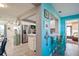 Bright living area flows into modern kitchen with stainless steel appliances and counter seating at 3715 98Th N Ave # 3, Pinellas Park, FL 33782