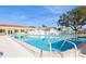 Inviting community pool with clear blue water and lounge chairs, perfect for relaxation at 3715 98Th N Ave # 3, Pinellas Park, FL 33782