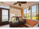 Cozy sunroom featuring a leather loveseat with a view to the backyard at 3715 98Th N Ave # 3, Pinellas Park, FL 33782