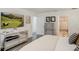 Main bedroom showcasing elegant decor, mirrored dresser, and open doorway to bathroom at 39 Pelican Pl, Belleair, FL 33756