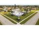 Community clubhouse and pool area with an American flag, creating a patriotic and welcoming atmosphere for all at 4069 102Nd N Pl, Clearwater, FL 33762