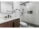 Modern bathroom features sleek vanity, updated shower with subway tile and glass door at 4069 102Nd N Pl, Clearwater, FL 33762