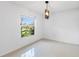 Bright dining room with large window and modern light fixture at 4069 102Nd N Pl, Clearwater, FL 33762
