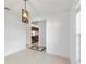 Dining room with modern light fixture and doorway to kitchen at 4069 102Nd N Pl, Clearwater, FL 33762