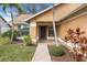 Inviting front entryway with brick pathway, lush landscaping, and a stylish front door at 4069 102Nd N Pl, Clearwater, FL 33762