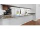 Kitchen featuring granite countertops, wood cabinets, and stainless steel appliances at 4069 102Nd N Pl, Clearwater, FL 33762