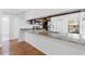 Bright kitchen featuring granite countertops, stainless steel appliances, and wood floors at 4069 102Nd N Pl, Clearwater, FL 33762