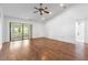 Bright living room featuring vaulted ceiling, recessed lighting, and sliding glass doors to outdoor space at 4069 102Nd N Pl, Clearwater, FL 33762