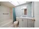 Bathroom features a shower-tub combo and a white vanity at 4582 Fox Lake Ct, Clearwater, FL 33762