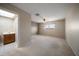 Spacious bedroom with neutral walls, carpet flooring and a lighted ceiling fan at 4582 Fox Lake Ct, Clearwater, FL 33762