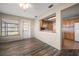 Cozy dining room features wood floors and a pass-through to the kitchen at 4582 Fox Lake Ct, Clearwater, FL 33762
