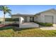 Well-maintained single-story home with landscaped front yard, and an attached one-car garage at 4582 Fox Lake Ct, Clearwater, FL 33762