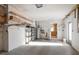 A bright garage with shelves for storage leads into the kitchen; water heater is visible at 4582 Fox Lake Ct, Clearwater, FL 33762