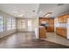 Cozy open-concept space with a kitchen area with wood cabinets and adjacent dining at 4582 Fox Lake Ct, Clearwater, FL 33762