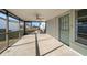 Screened in lanai with ceiling fan offers an outdoor living space at 4582 Fox Lake Ct, Clearwater, FL 33762