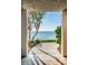 Breathtaking water view from the unit's private balcony, framed by lush tropical greenery at 4830 Osprey S Dr # 305, St Petersburg, FL 33711