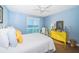 Bright bedroom with blue walls, wood floors, and a large window with water views at 4830 Osprey S Dr # 305, St Petersburg, FL 33711
