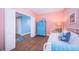 Bright and airy bedroom with wooden floors, a closet, and beach-themed decorations at 4830 Osprey S Dr # 305, St Petersburg, FL 33711