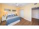 Bright bedroom with yellow walls, wood floors, and a window at 4830 Osprey S Dr # 305, St Petersburg, FL 33711