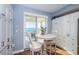 Bright breakfast nook features a round table, and balcony access with beautiful water views at 4830 Osprey S Dr # 305, St Petersburg, FL 33711