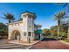 Mediterranean-style entry gate with a red tile roof and lush tropical landscaping at 4830 Osprey S Dr # 305, St Petersburg, FL 33711