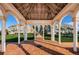 Gazebo with brick pavers, white columns, and views of condo complex at 4830 Osprey S Dr # 305, St Petersburg, FL 33711