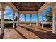 Gazebo with brick pavers, white columns, and views of the water at 4830 Osprey S Dr # 305, St Petersburg, FL 33711