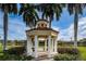 Picturesque gazebo with columns and benches surrounded by lush landscaping near the water at 4830 Osprey S Dr # 305, St Petersburg, FL 33711
