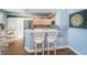 Stylish kitchen with white cabinets and breakfast bar seating at 4830 Osprey S Dr # 305, St Petersburg, FL 33711
