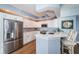 Updated kitchen with stainless steel appliances and peninsula with seating at 4830 Osprey S Dr # 305, St Petersburg, FL 33711