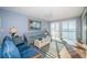 Bright and airy living room with water views, stylish furniture, and a coastal-inspired design at 4830 Osprey S Dr # 305, St Petersburg, FL 33711