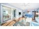 Bright living room featuring waterfront views, cozy seating, and access to a private balcony at 4830 Osprey S Dr # 305, St Petersburg, FL 33711