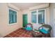 Charming patio featuring tiled flooring, comfortable seating, and stylish decor for outdoor relaxation at 4830 Osprey S Dr # 305, St Petersburg, FL 33711